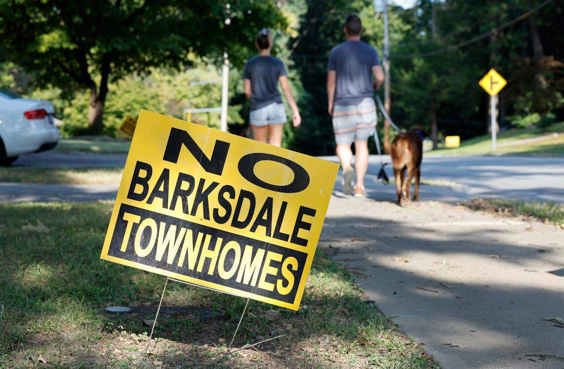 Signs protesting proposed townhomes dot Barksdale Drive in the Woodcrest neighborhood of Raleigh, as seen on Monday, August 26, 2024.