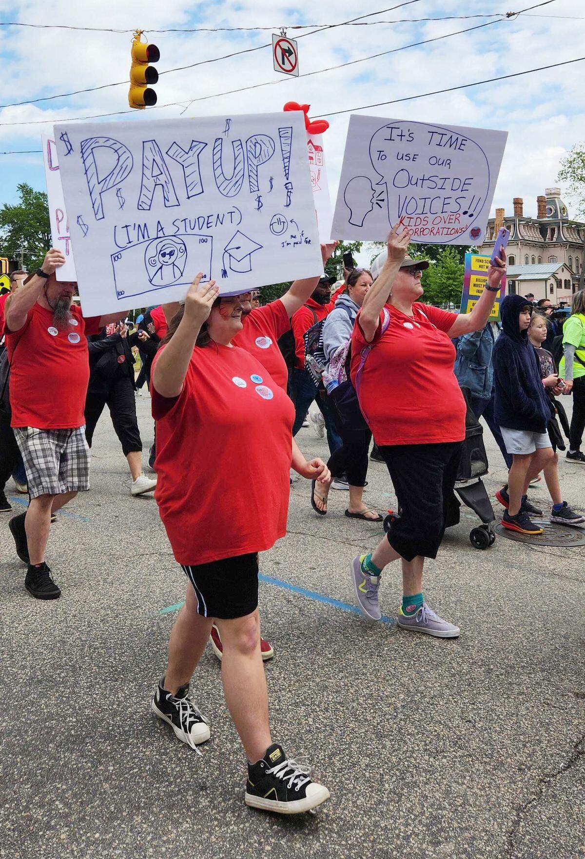 Protesters march in support of teachers and education funding in downtown Raleigh, Friday, May 1, 2026.