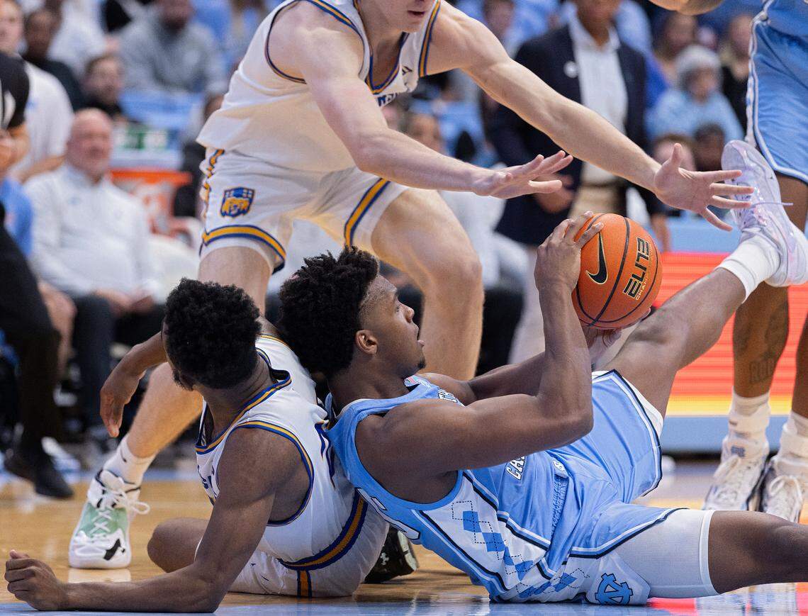 North Carolina’s Harrison Ingram grabs a loose ball away from UC Riverside’s Barrington Hargress and Benjamin Griscti during the second half of the Tar Heels’ 77-52 win on Friday, Nov. 17, 2023, at the Smith Center in Chapel Hill, N.C.