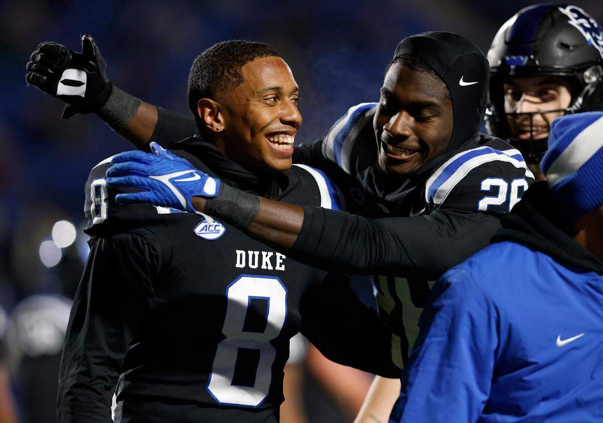 Duke’s Jordan Moore is congratulated by teammate Joshua Pickette after scoring a touchdown during the second half of the Blue Devils’ 24-21 win over Wake Forest on Thursday, Nov. 2, 2023, at Wallace Wade Stadium in Durham, N.C.