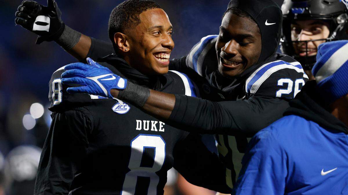 Duke’s Jordan Moore is congratulated by teammate Joshua Pickette after scoring a touchdown during the second half of the Blue Devils’ 24-21 win over Wake Forest on Thursday, Nov. 2, 2023, at Wallace Wade Stadium in Durham, N.C.