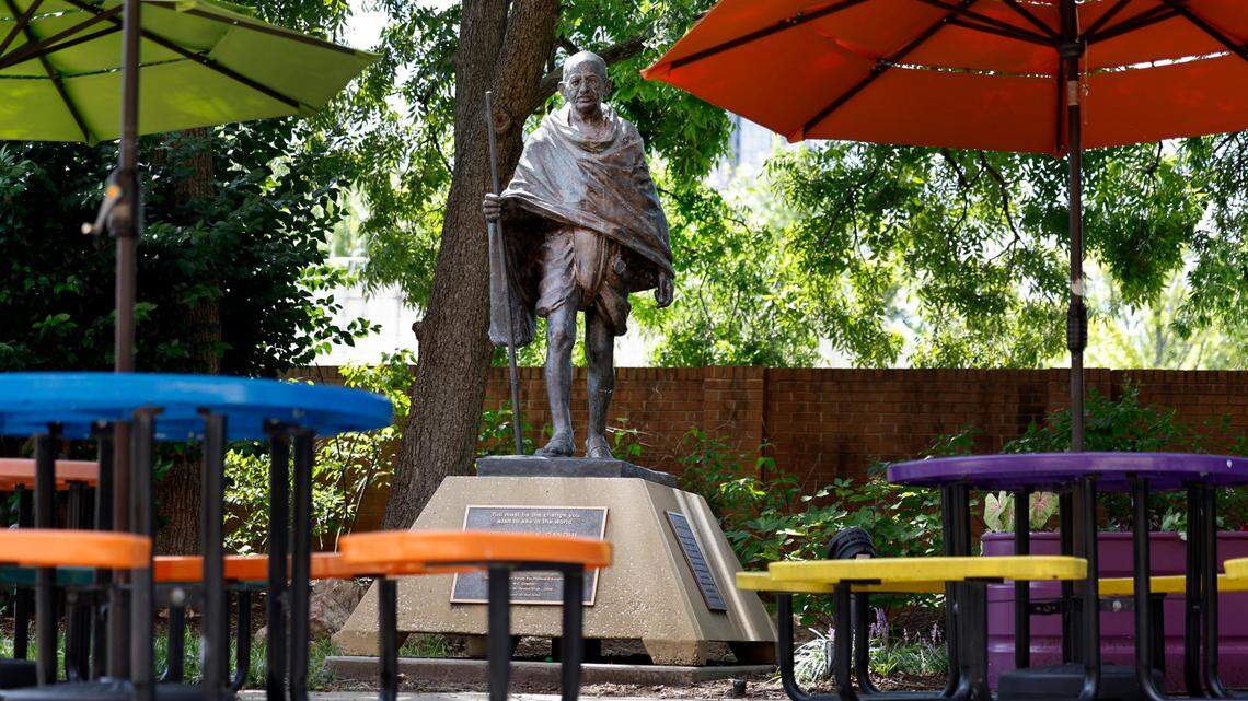 A statue of Mohandas Gandhi stands outside the Marbles Kids Museum and IMAX theater. Photographed Wednesday, August 14, 2024.