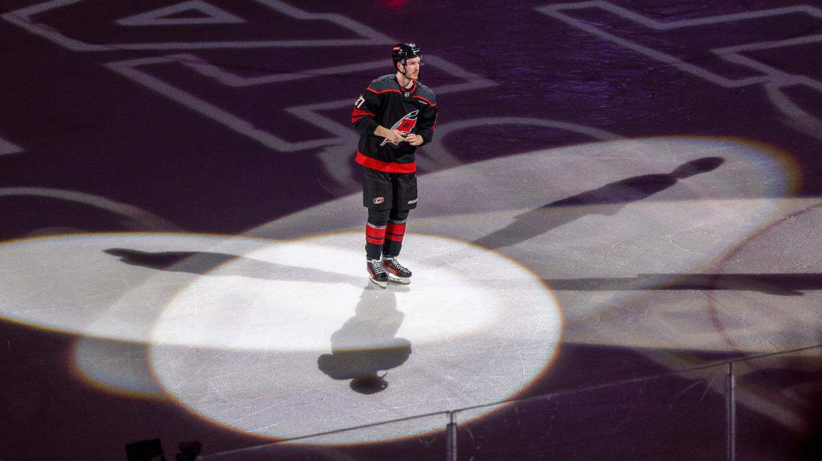 Carolina Hurricanes right wing Andrei Svechnikov (37) skates into the spotlight as he is recognized following the Hurricanes’ 4-0 victory over the Washington Capital in Game 3 of their series on Saturday, May 10, 2025 at Lenovo Center in Raleigh, N.C.
