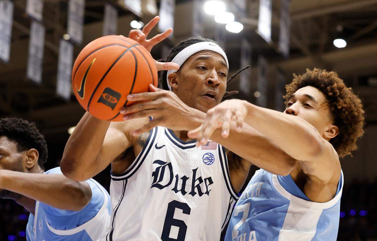 Duke’s Maliq Brown (6) pulls in the rebound from North Carolina’s Seth Trimble (7) during the first half of Duke’s game against UNC at Cameron Indoor Stadium in Durham, N.C., Saturday, Feb. 1, 2025.