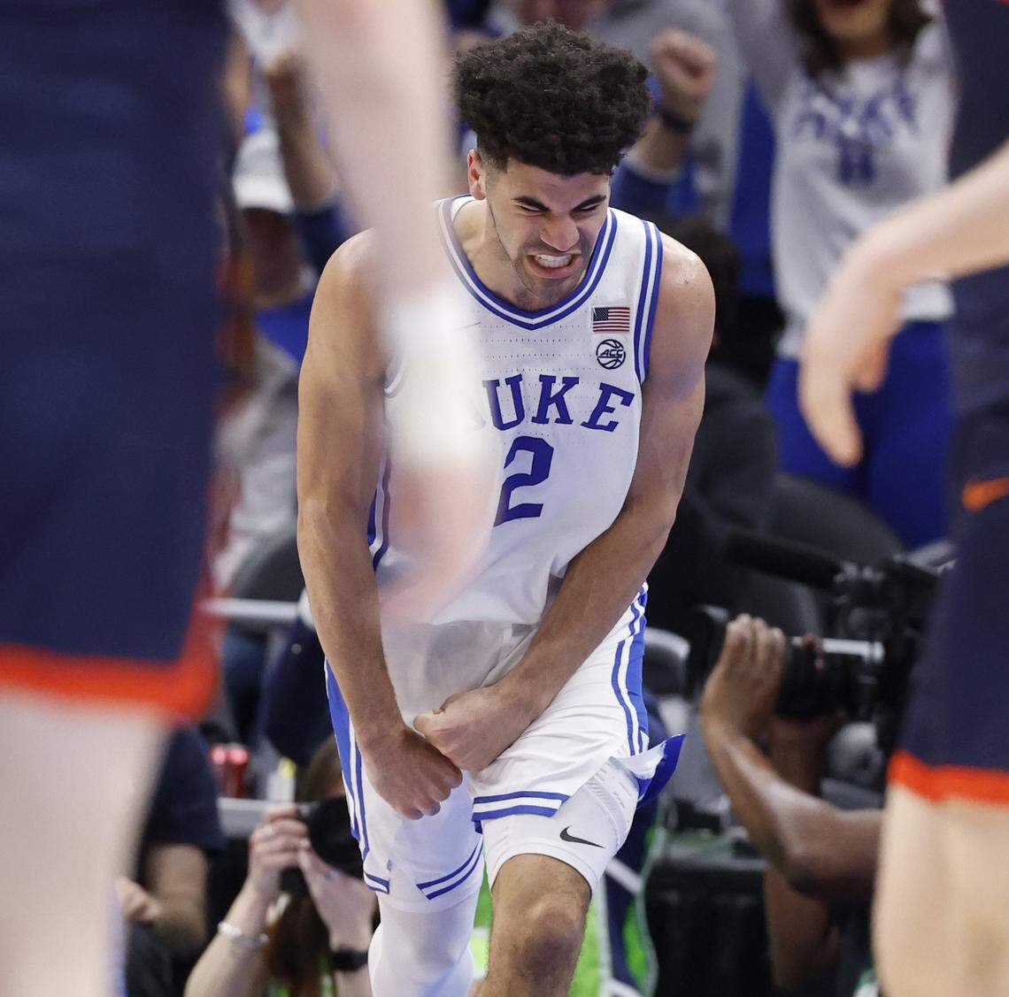 Duke’s Cayden Boozer (2) celebrates making a basket during the first half of Duke’s game against Virginia in the finals of the 2026 ACC Men’s Basketball Tournament at the Spectrum Center in Charlotte, N.C., Saturday, March 14, 2026.