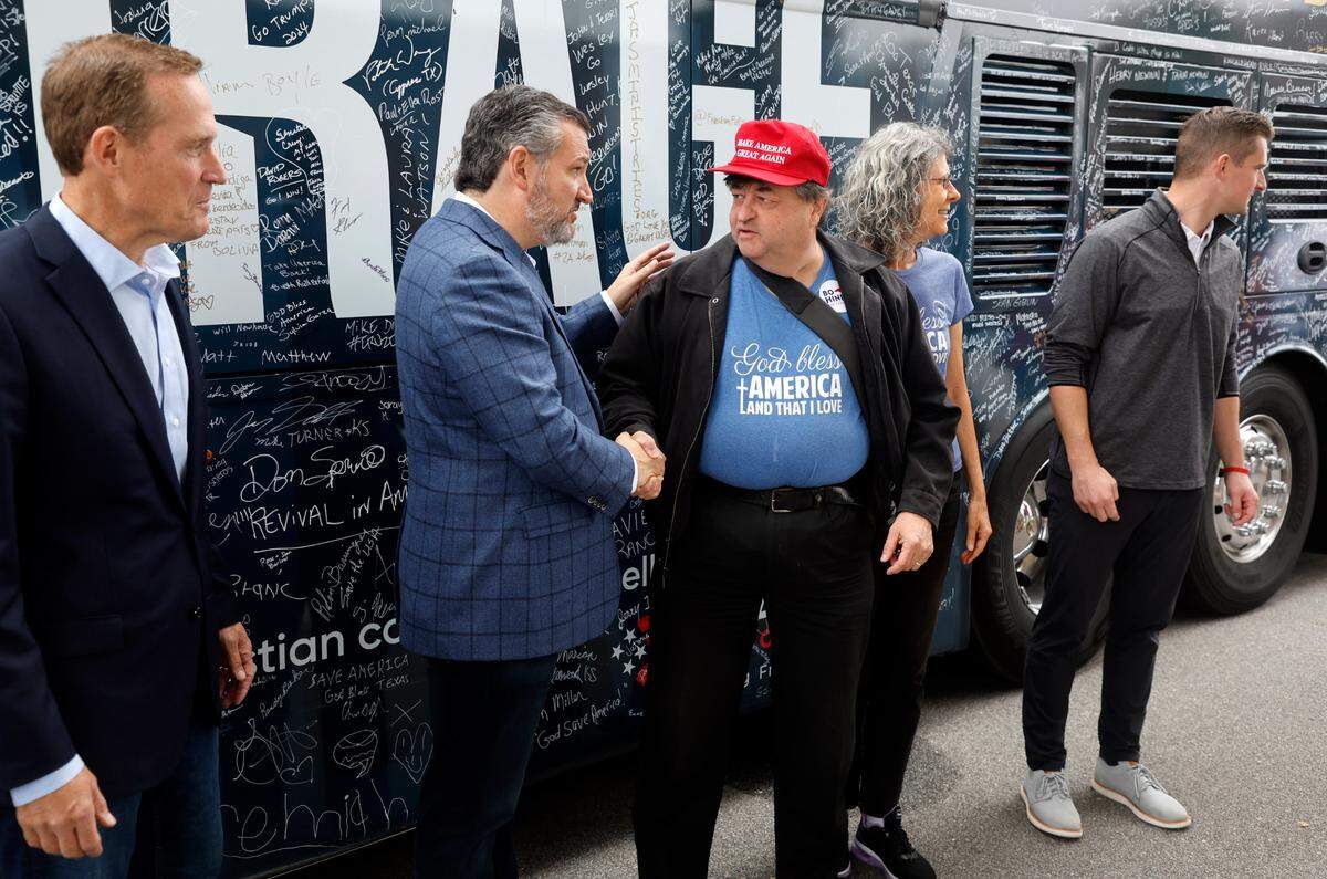 Kevin and Elaine Ross of Raleigh greet Texas Sen. Ted Cruz, center, Republican U.S. Senate candidate Ted Budd, left, and Bo Hines, Republican running for the 13th Congressional District, right, after a rally in Selma, N.C., Tuesday, Oct. 25, 2022.