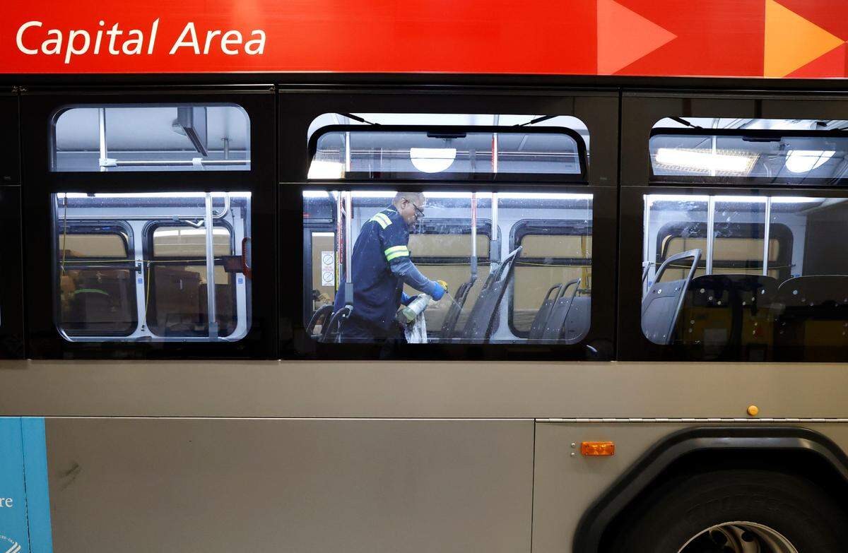 Cody Lee cleans the bare seat frames after the worn cloth seats were removed on a GoRaleigh bus at GoRaleigh’s maintenance headquarters off Poole Road on Saturday, May 10, 2025. Lee and Daniel Moore were taking out the old seat backs and bottoms and installing new vinyl ones.
