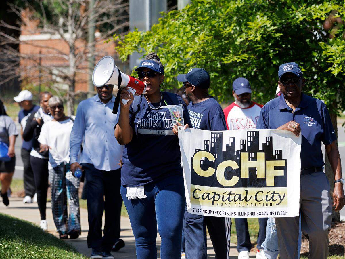 People march during a rally to save St. Augustine’s University in Raleigh, N.C. on Monday, April 29, 2024. The event was organized by the Capital City Hope Foundation, Falcons Unite, and the SAVESAU Coalition.