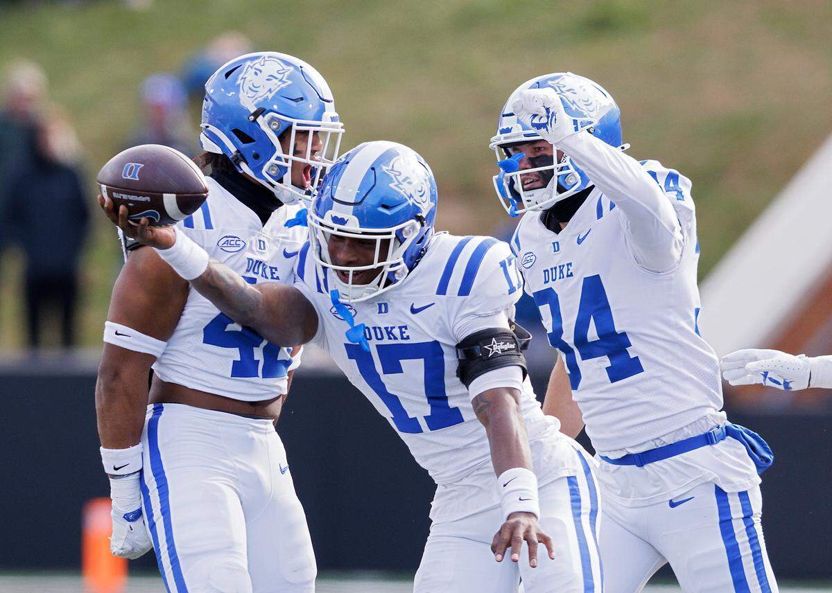 Duke’s Vontae Floyd, center, reacts after recovering a Wake Forest fumble during the second half of the Blue Devils’ 23-17 win at Allegacy Stadium on Saturday, Nov. 30, 2024, in Winston-Salem, N.C.