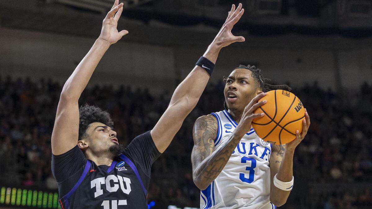 Duke forward Isaiah Evans (3) drives to the basket against  TCU forward David Punch (15) in the first half on Saturday, March 21, 2026, during the second round of the NCAA Tournament at Bon Secours Arena in Greenville, S.C.