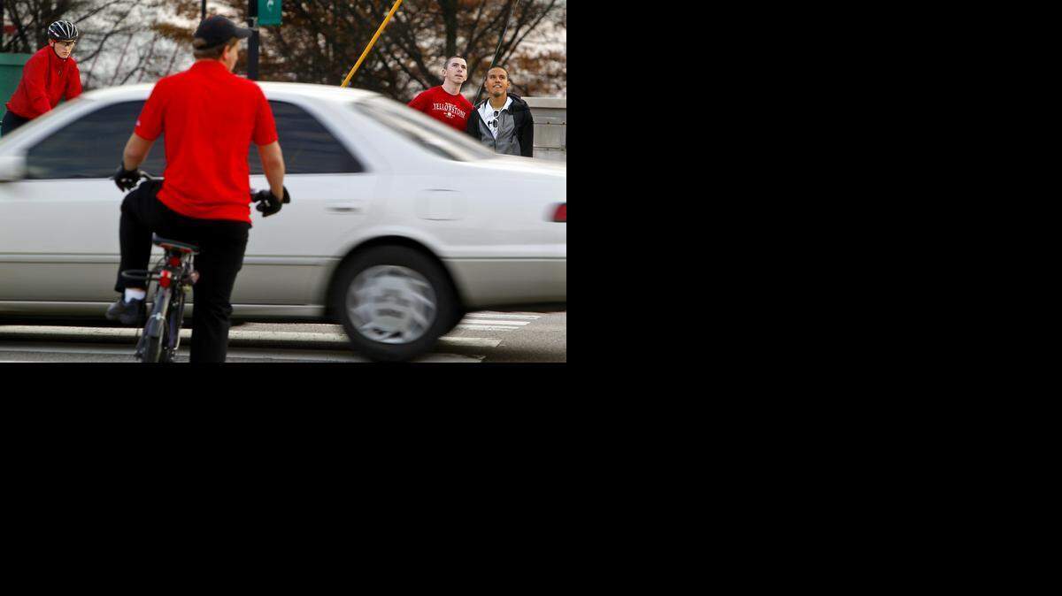 N.C. State students Tucker Daughtridge, second from right, and Abimael Torres Rivera, far right, cross Western Boulevard at the intersection of Avent Ferry Road near campus on Thursday. Plans call for a tunnel to be built under Western Boulevard at Avent Ferry Road.
