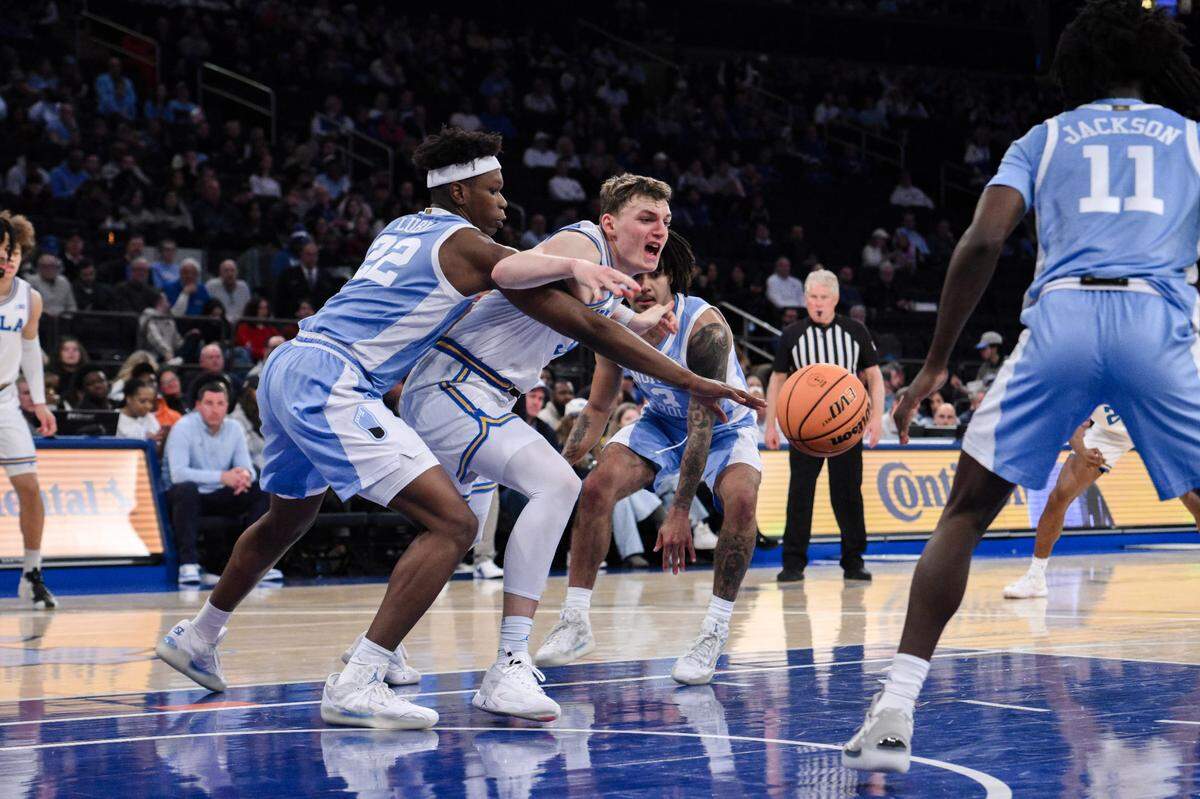 North Carolina Tar Heels forward Ven-Allen Lubin (22) steals the ball away from UCLA Bruins forward Tyler Bilodeau (34) during the first half at Madison Square Garden.