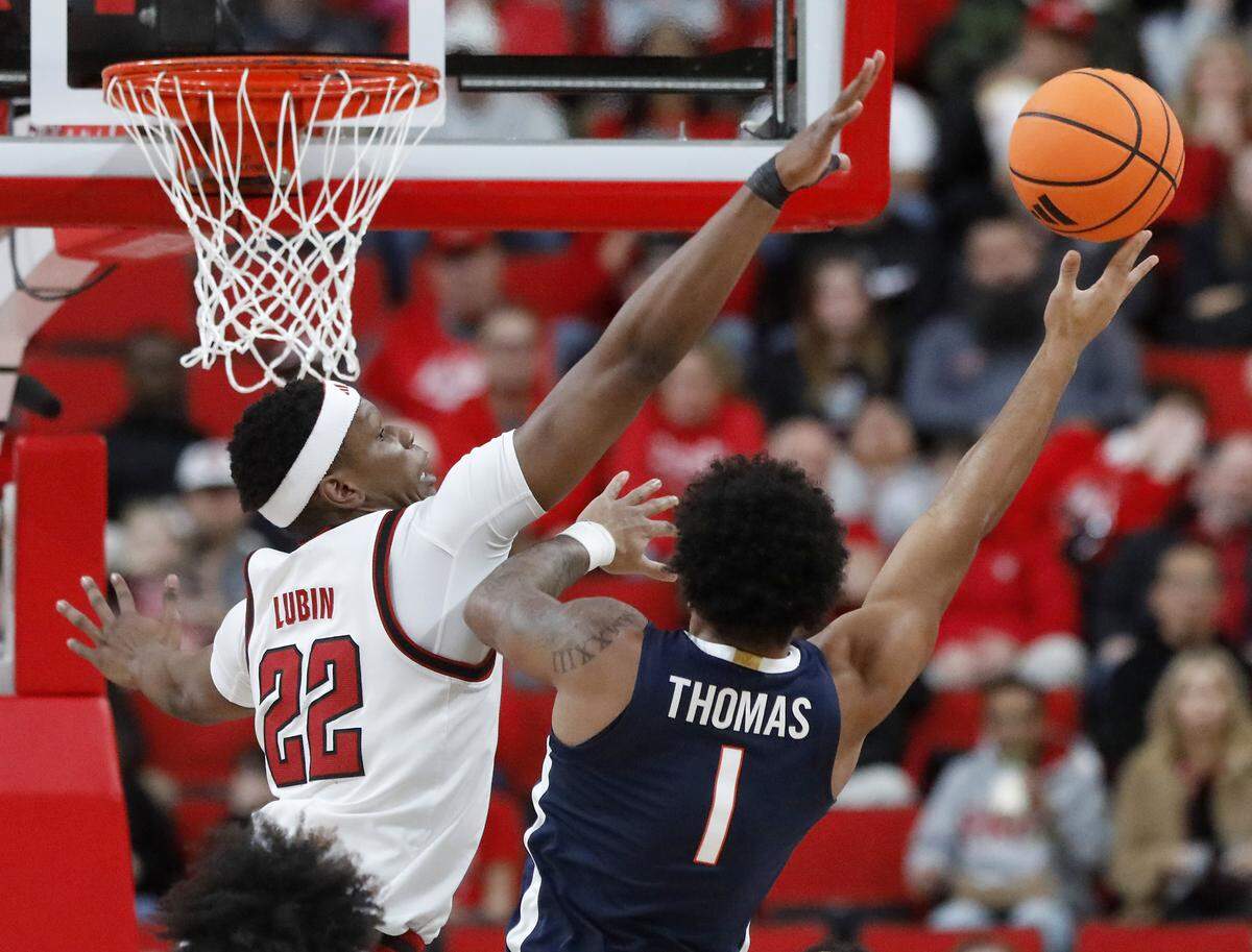 N.C. State’s Ven-Allen Lubin pressures Virginia’s Malik Thomas during the first half of the Wolfpack’s 76-61 loss on Saturday, Jan. 3, 2026, at Lenovo Center in Raleigh, N.C.