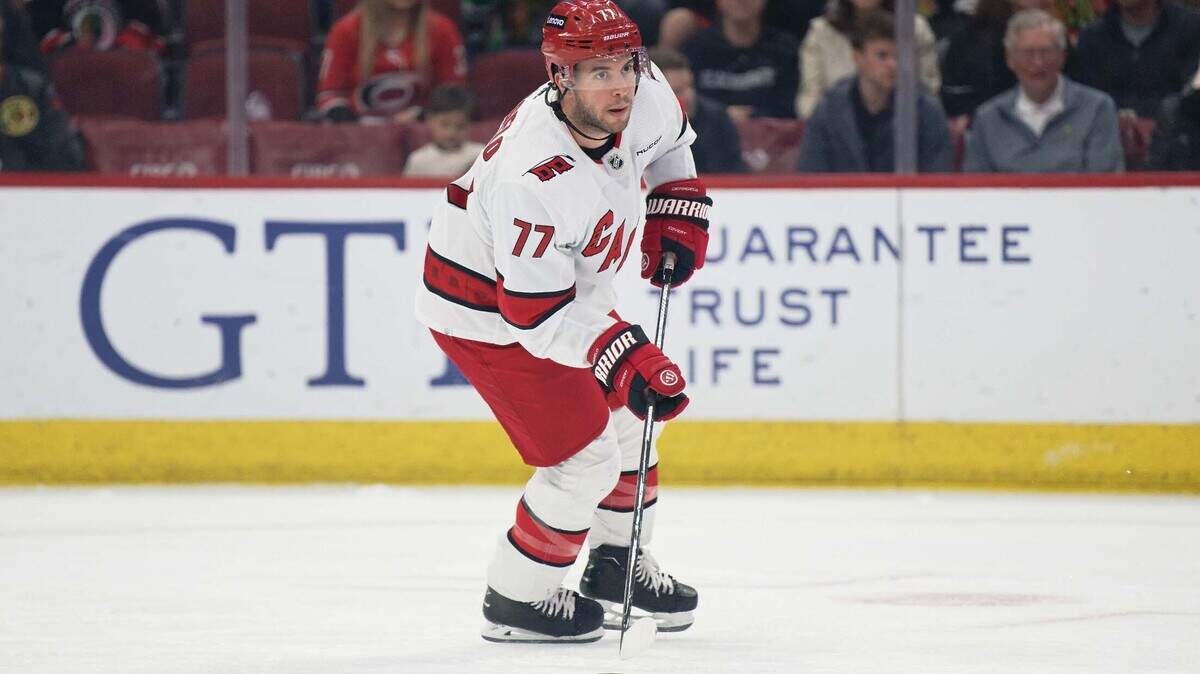 Apr 14, 2024; Chicago, Illinois, USA; Carolina Hurricanes defenseman Tony DeAngelo (77) skates against the Chicago Blackhawks at United Center.