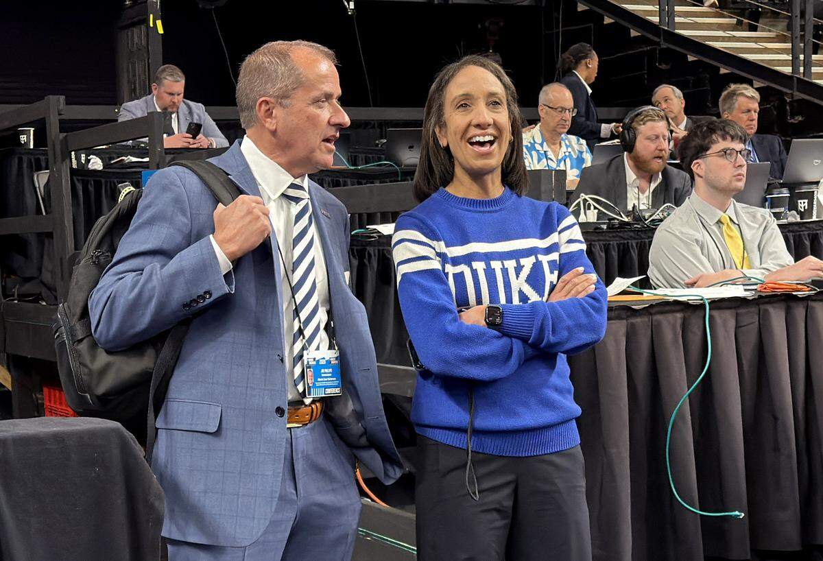Duke Director of Athletics Nina King talks with ACC Commissioner Jim Phillips before Duke’s game against Siena in the first round of the NCAA Men’s Basketball Tournament at Bon Secours Wellness Arena in Greenville, S.C., Thursday, March 19, 2026.