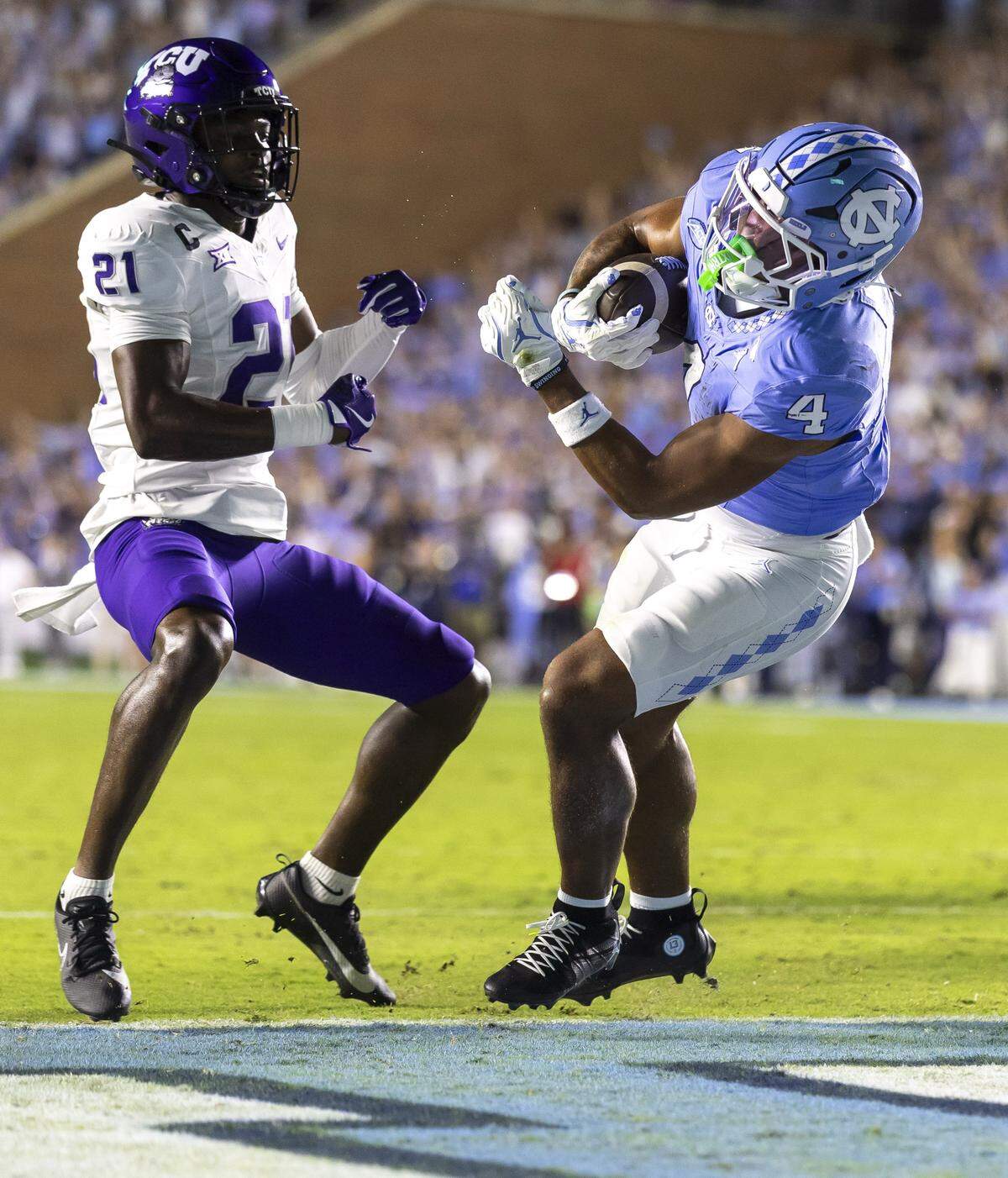 North Carolina running back Caleb Hood (4) scores a touchdown on an eight yard run in the first quarter to take a 7-0 lead over TCU on Monday, September 1, 2025 at Kenan Stadium in Chapel Hill, N.C. 