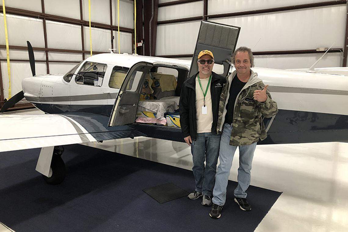 Pilot Ed Filangeri and co-pilot Chris Wernau prepare to fly a plane loaded with turtles in banana boxes from Massachusetts to North Carolina.