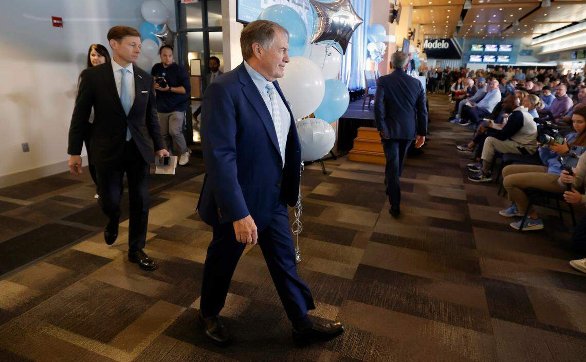 New North Carolina head football coach Bill Belichick enters the press conference room at the Loudermilk Center for Excellence at UNC in Chapel Hill, N.C., Thursday, Dec. 12, 2024.