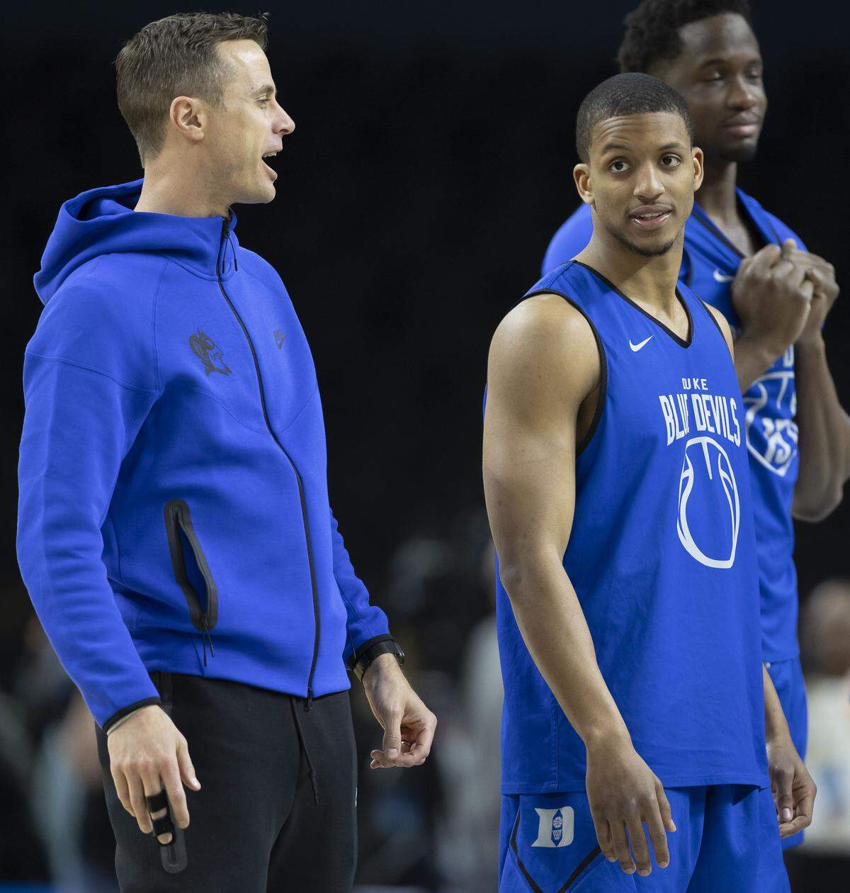 Duke walk-on Brock Davis (50) listens to coach Jon Scheyer during the Blue Devils’ workout on Wednesday, March 18, 2026, at Bon Secours Arena in Greenville, S.C.  Davis joined the team last week for the ACC Tournament after starters Patrick Ngongba II and Caleb Foster (1) suffered injuries.