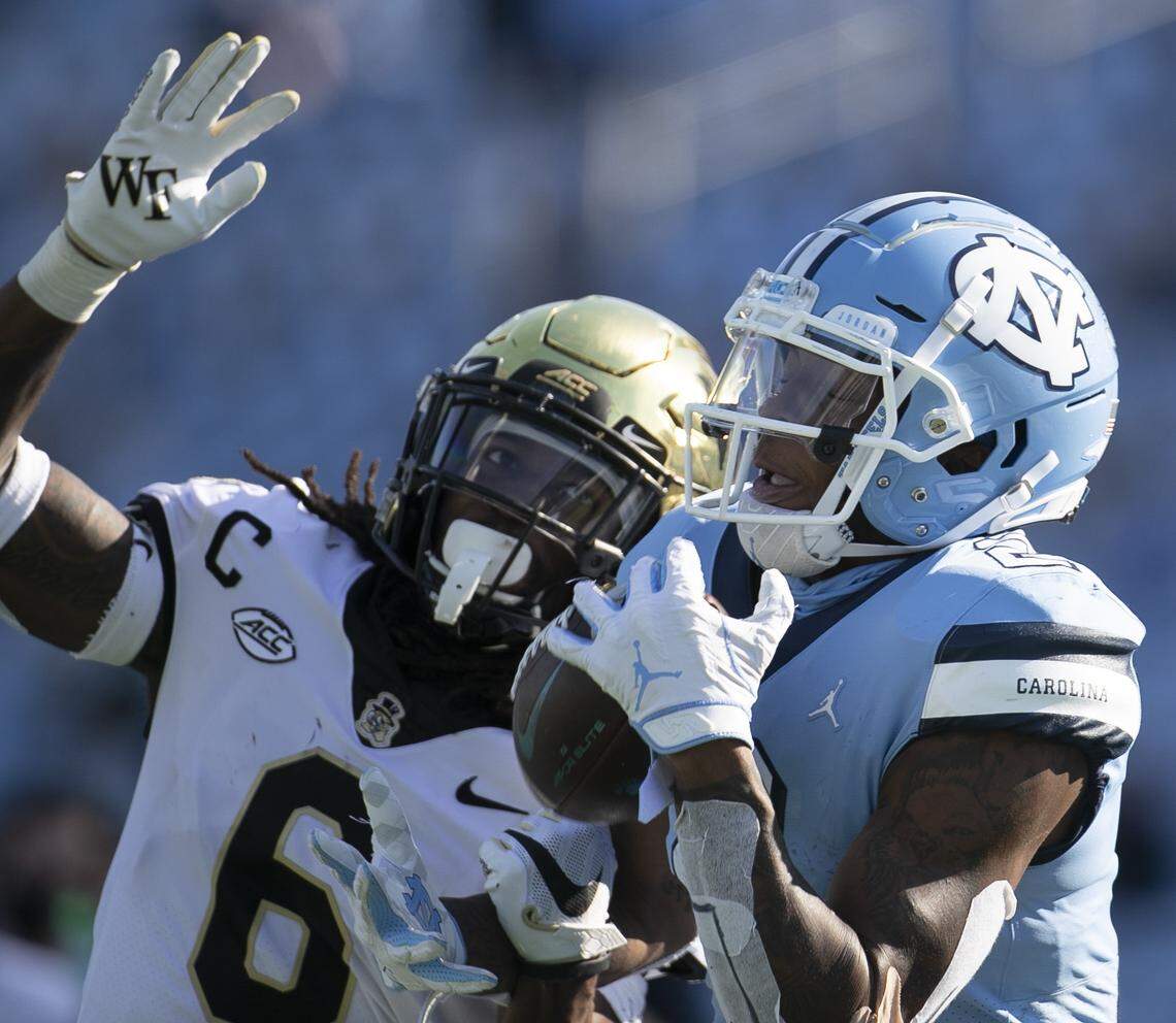Wake Forest defense back Ja’Sir Taylor (6) defends North Carolina’s Dyami Brown (2) in the second quarter at Kenan Stadium on Saturday, November 14, 2020 in Chapel Hill, N.C. Taylor took the ball away from Brown and was credited with an interception.