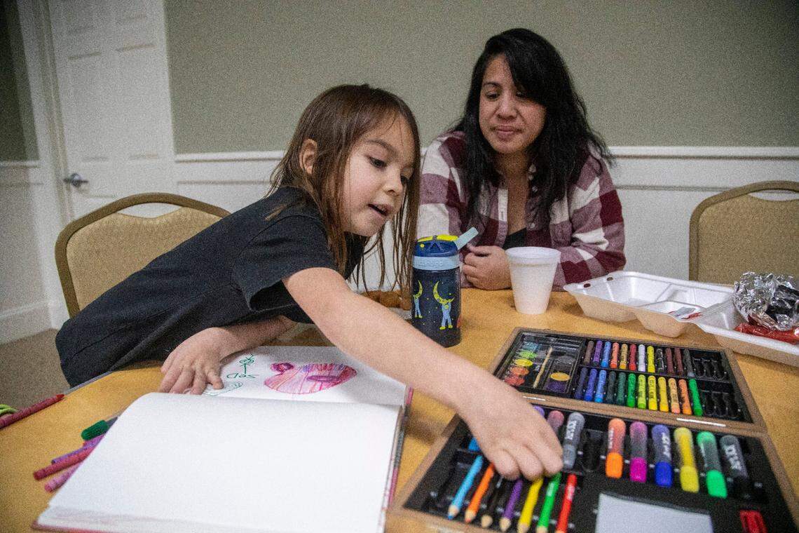 After days without power,  Leilani Tedtaotao and her son Rowan Allen, 6, take refuge at the First Baptist Church of Pinehurst Tuesday, Dec. 6, 2022 where a N.C. Baptists&nbsp;on Mission&nbsp;disaster relief crew was serving food, washing laundry, offering hot showers and power to charge devices. Two deliberate attacks on electrical substations in Moore County Saturday evening caused days-long power outages for tens of thousands of customers.