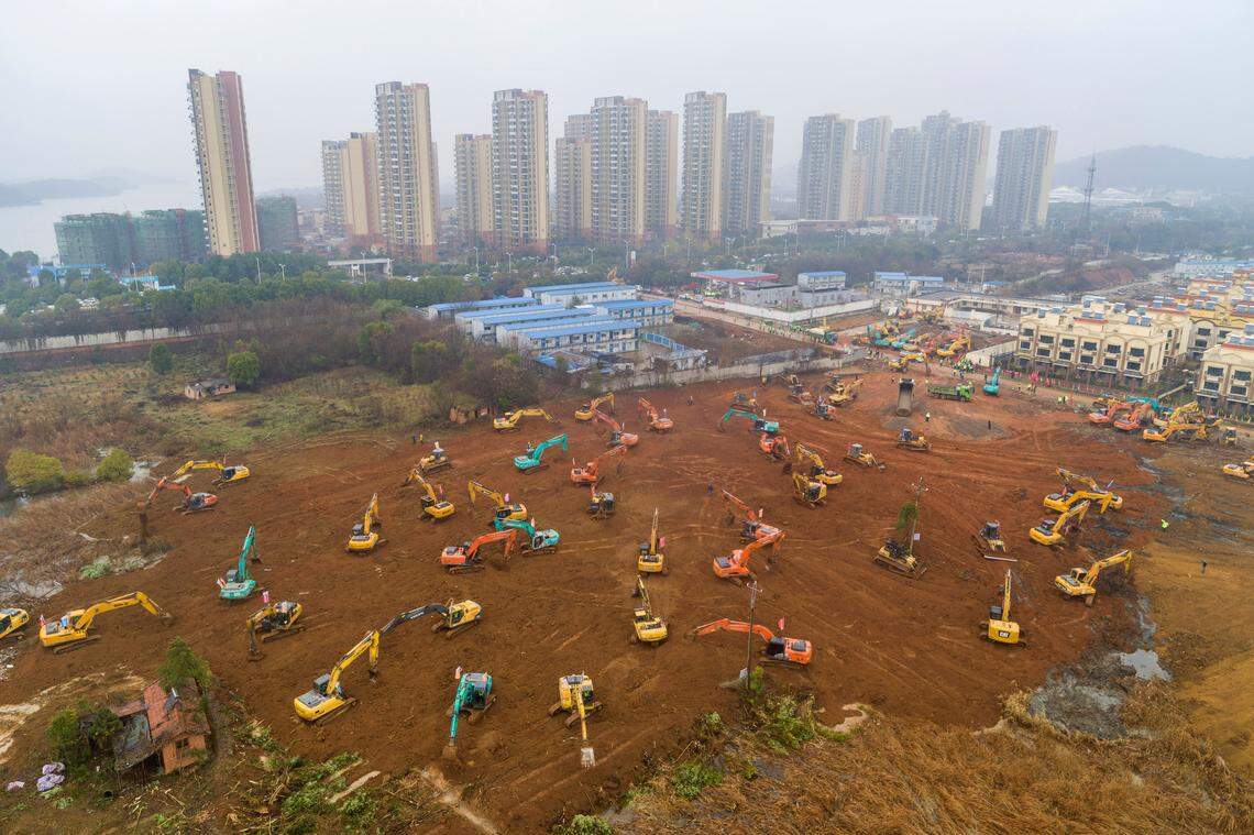 Heavy equipment works at a construction site for a field hospital in Wuhan in central China’s Hubei Province, Friday, Jan. 24, 2020. China is swiftly building a 1,000-bed hospital dedicated to patients infected with a new virus that has killed 26 people, sickened hundreds and prompted unprecedented lockdowns of cities during the country’s most important holiday.