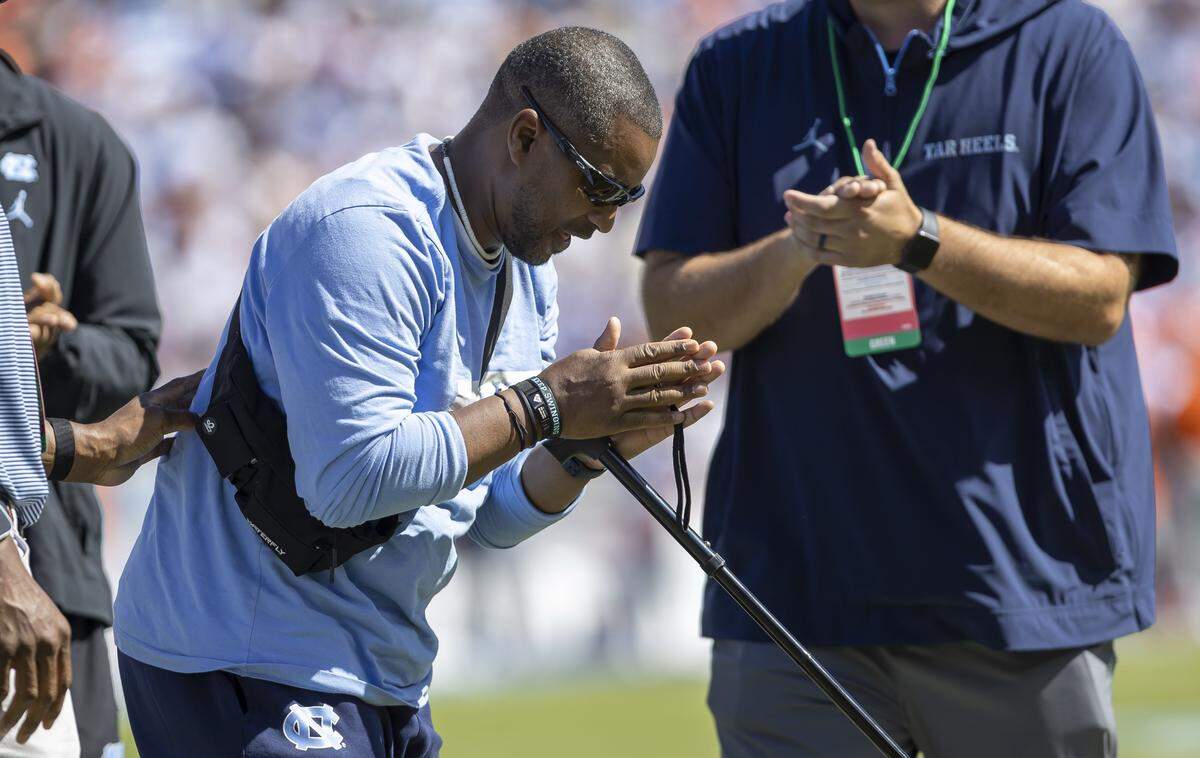 North Carolina football team chaplain Mitch Mason shows his appreciation for the ovation, as he is honored in the first half during the Tar Heels’ game against Clemson on Saturday, October 4, 2025 at Kenan Stadium in Chapel Hill, N.C. 