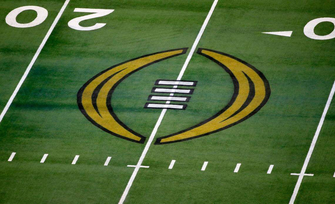 FILE - The College Football Playoff logo is shown on the field at AT&T Stadium before the Rose Bowl NCAA college football game between Notre Dame and Alabama in Arlington, Texas, Jan. 1, 2021. The College Football Playoff announced Thursday, Dec. 1, 2022, it will expand to a 12-team event, starting in 2024, finally completing an 18-month process that was fraught with delays and disagreements. The announcement comes a day after the Rose Bowl agreed to amend its contract for the 2024 and ’25 seasons, the last hurdle CFP officials needed cleared to triple the size of what is now a four-team format. (AP Photo/Roger Steinman, File)