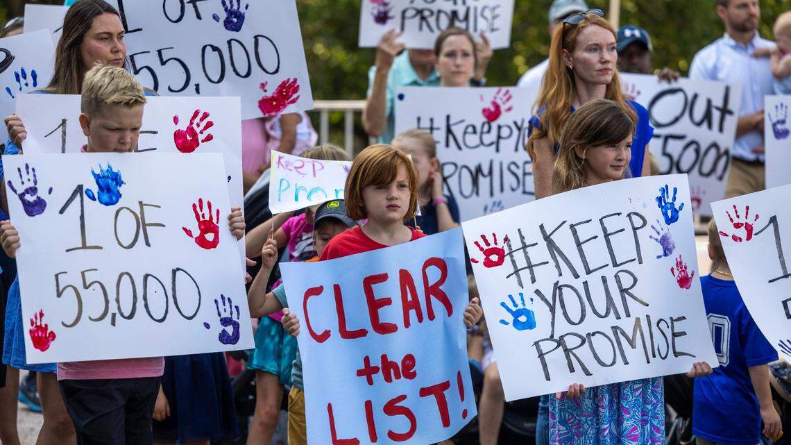 Parents and students urge Republican lawmakers to keep their promise to fully fund private school vouchers for the 55,000 students on the Opportunity Scholarship waiting list during a rally on Halifax Mall in Raleigh on Wednesday, July 31, 2024.