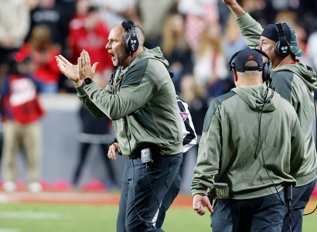 N.C. State head coach Dave Doeren cheers on the team at the start of the fourth quarter during N.C. State’s 22-21 victory over Virginia Tech at Carter-Finley Stadium in Raleigh, N.C., Thursday, Oct. 27, 2022.