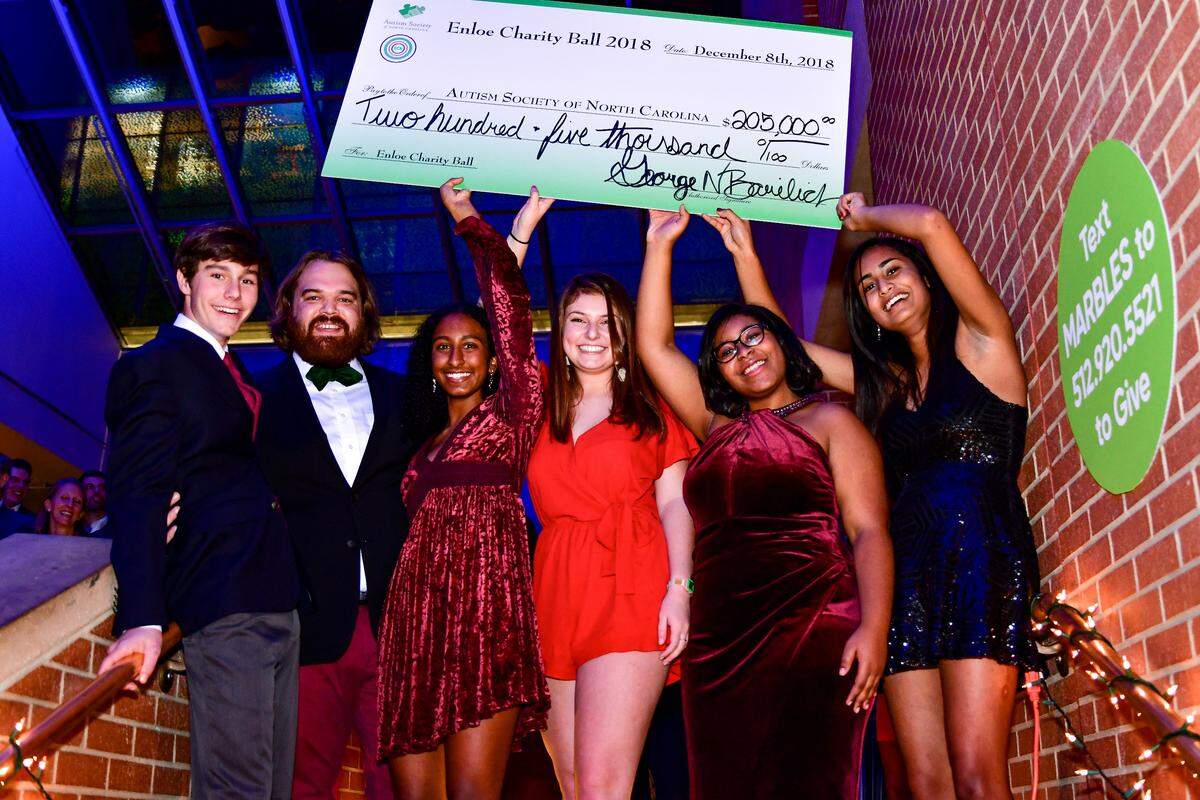 Members of Enloe High School’s student council hold the $205,000 check they presented to the Autism Society of North Carolina at the Enloe Charity Ball at Marbles Kids Museum in Raleigh, N.C., on Dec. 8, 2018.