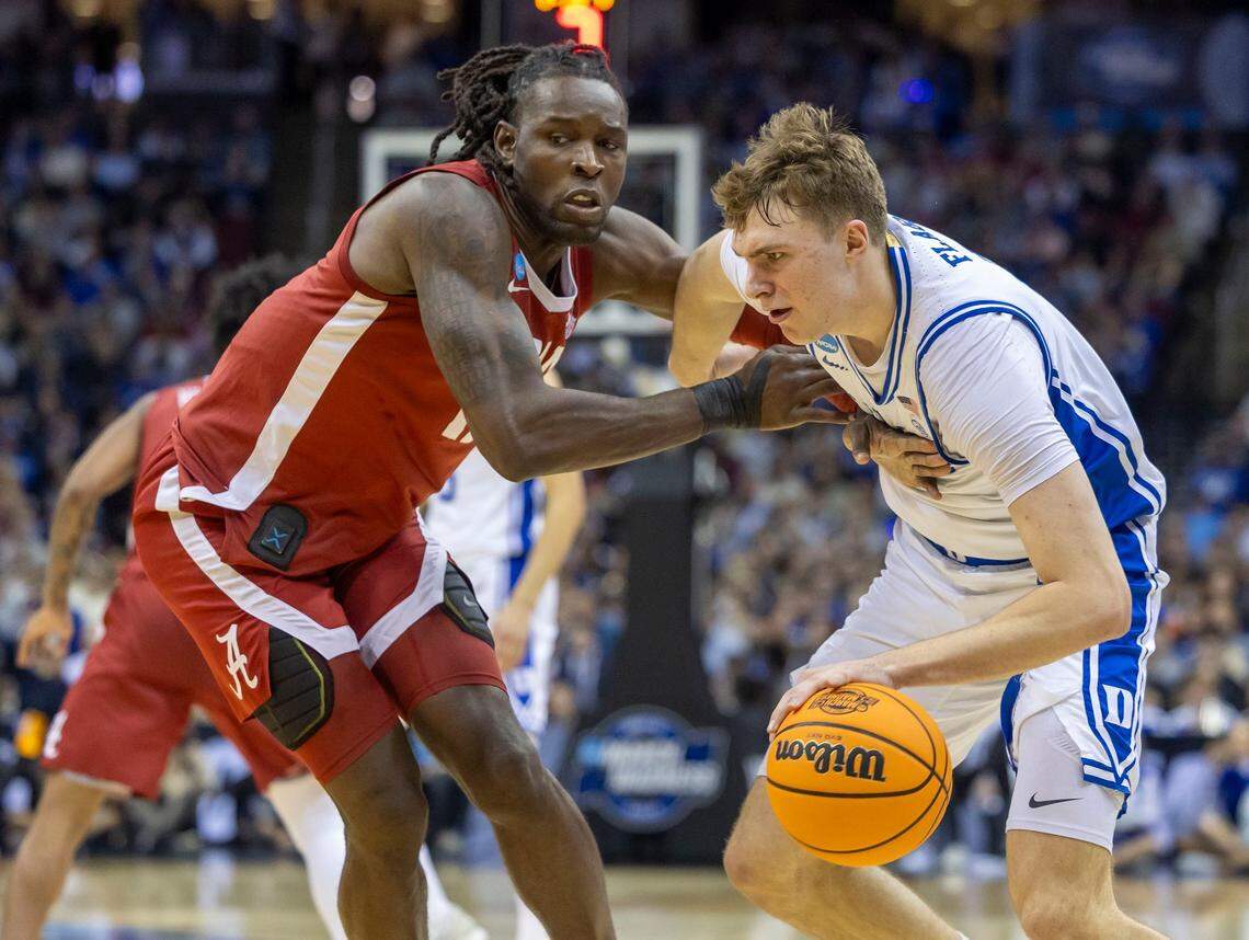 Alabama’s Clifford Omoruyi (11) works slow Duke forward Cooper Flagg (2) in the first half on Saturday, March 29, 2025 during the NCAA East Regional final at Prudential Center in Newark, N.J.