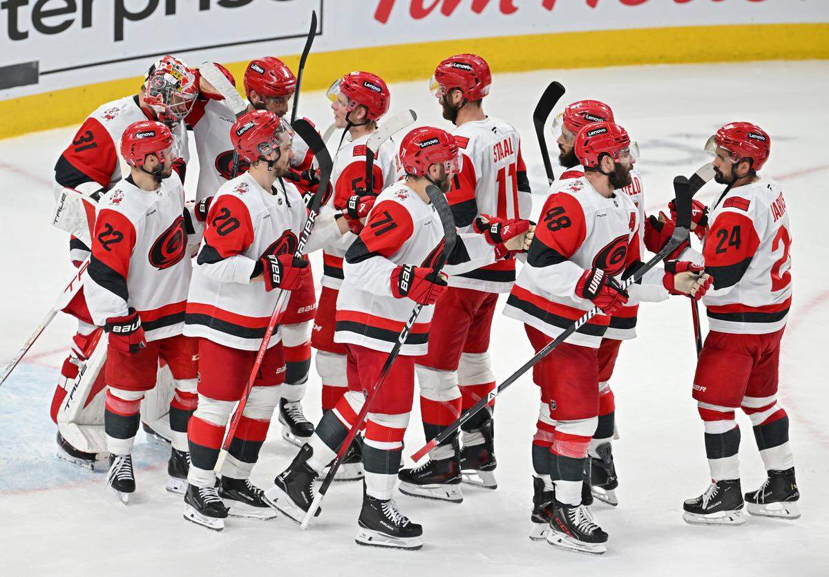 Frederik Andersen #31 of the Carolina Hurricanes is congratulated by teammates after their 4-0 victory against the Montreal Canadiens in Game Four of the Eastern Conference Final of the 2026 Stanley Cup Playoffs at Bell Centre on May 27, 2026 in Montreal, Quebec, Canada. 