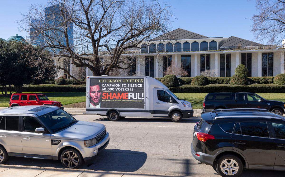 A mobile billboard circles the North Carolina General Assembly as lawmakers gather inside for the opening day of their 2025 session on Wednesday, January 8, 2025 in Raleigh, N.C. Common Cause North Carolina is paying for the billboard to bring light to the contested 2024 NC Supreme Court race between Allison Riggs, and Jefferson Griffin, which hasn’t not been certified.   