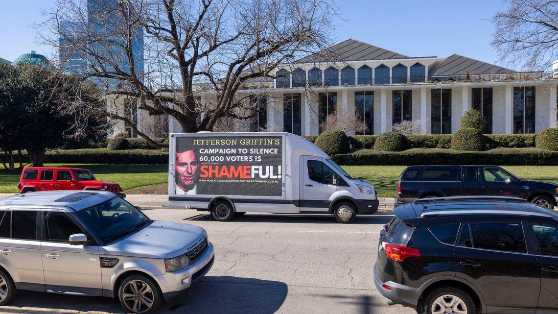 A mobile billboard circles the North Carolina General Assembly as lawmakers gather inside for the opening day of their 2025 session on Wednesday, January 8, 2025 in Raleigh, N.C.