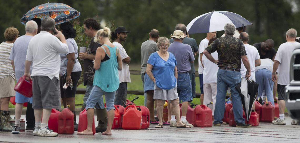 Alice Cooley and her husband Calvin of Bridgeton, N.C.wait in line for gasoline at the River Bend Fuel Mart on Saturday, September 15, 2018 in River Bend, N.C. The Cooleys are without power and drove around Craven County looking for gasoline on Friday after Hurricane Florence caused widespread flooding and power outages.