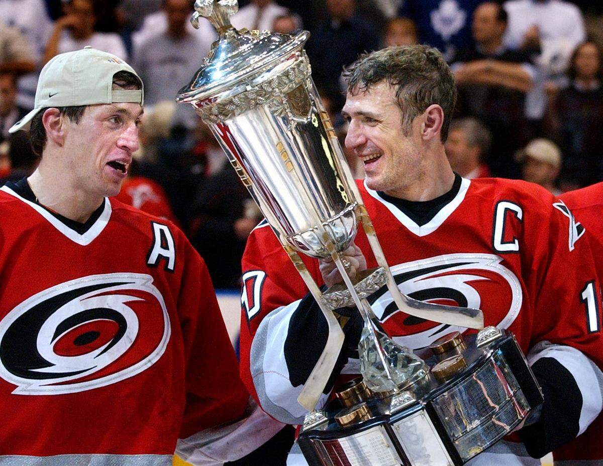 CANES6.SP.052802.RTW--Toronto, Canada--Carolina Hurricanes (10) Ron Francis, and teammate (17) Rod Brind’Amour accept the Prince of Wales trophy after they defeated Toronto 2-1 in overtime to win the Eastern Conference Championship Tuesday night at the Air Canada Center. stf/Robert Willett