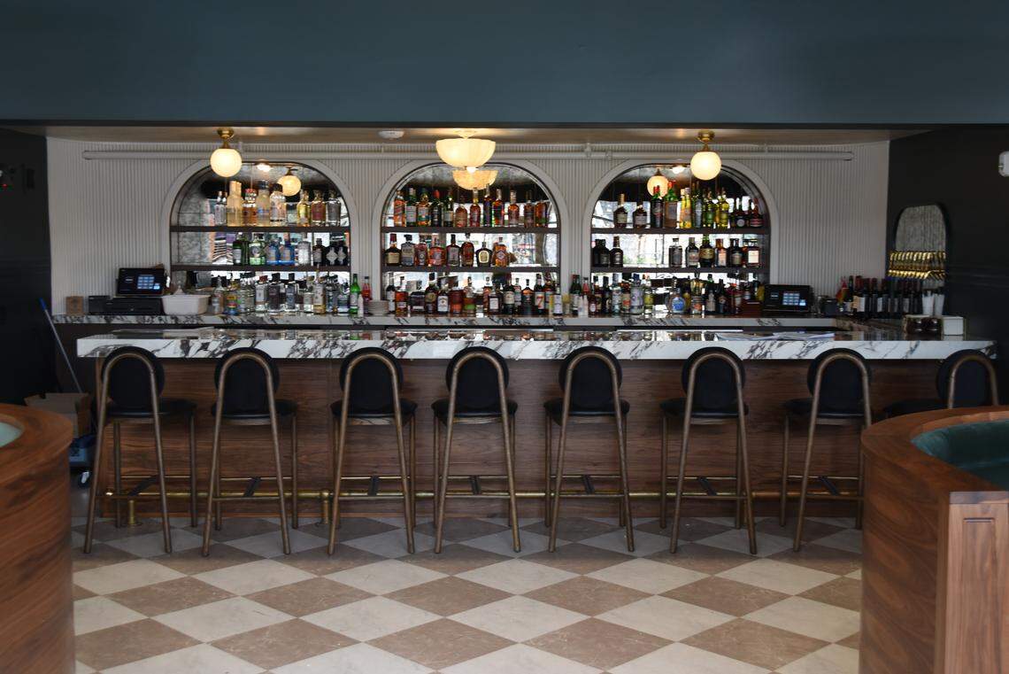 A centerpiece bar is the first thing diners will see at the new Delancey Tavern in Durham.
