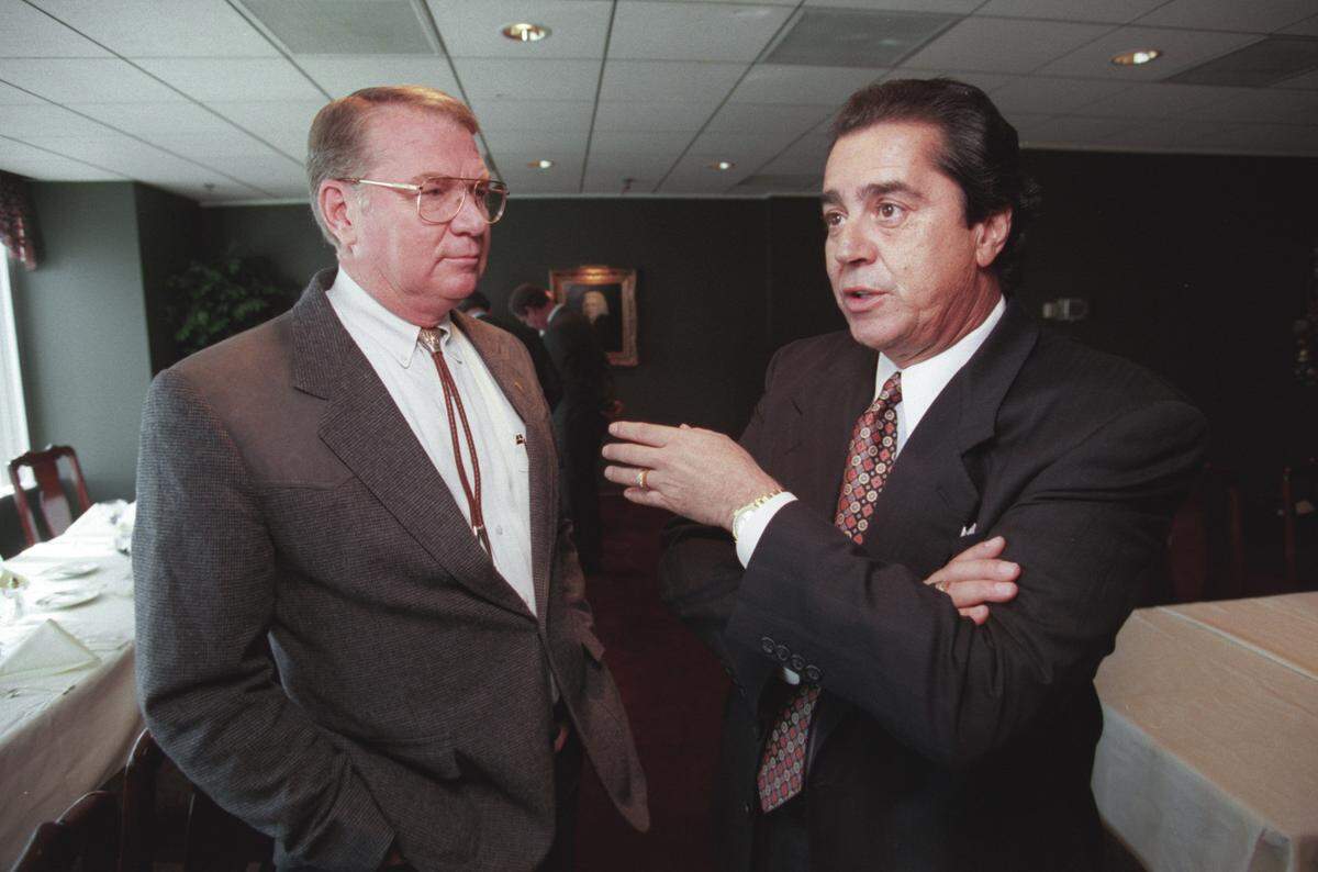 A 1996 photo shows Steve Stroud of the Centennial Authority, left, listening to Felix Sabates, potential NHL owner, speak during a lunch meeting. Sabates was heading up a group to bring an NHL expansion team to the Raleigh.