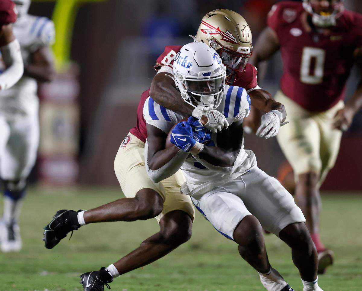 Duke’s Jaquez Moore is tackled by Florida State’s Renardo Green during the first half of the Blue Devils’ game against Florida State on Saturday, Oct. 21, 2023, in Tallahassee, Fla.
