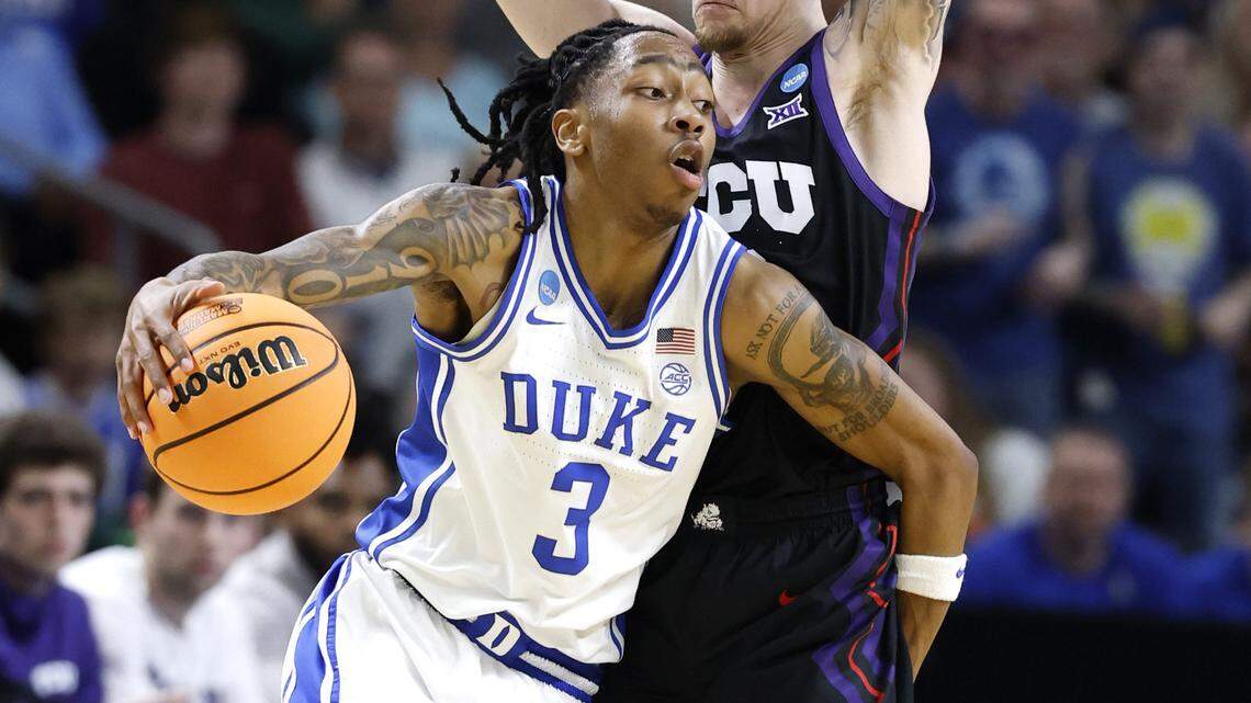 Duke’s Isaiah Evans (3) drives around TCU’s Brock Harding (2) during the first half of Duke’s game against TCU in the second round of the NCAA Men’s Basketball Tournament at  Bon Secours Wellness Arena in Greenville, S.C., Saturday, March 21, 2026.
