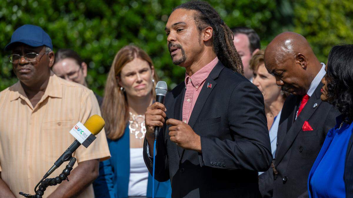 Braxton Winston III, Democratic nominee for state Labor Commissioner, speaks during a press conference hosted by North Carolina Black political action committees outside the North Carolina General Assembly on Wednesday, Sept. 4, 2024. Political action committees including Simkins PAC, Durham Committee and Raleigh Wake Citizens endorsed a slate of statewide candidates made up entirely of Democrats.