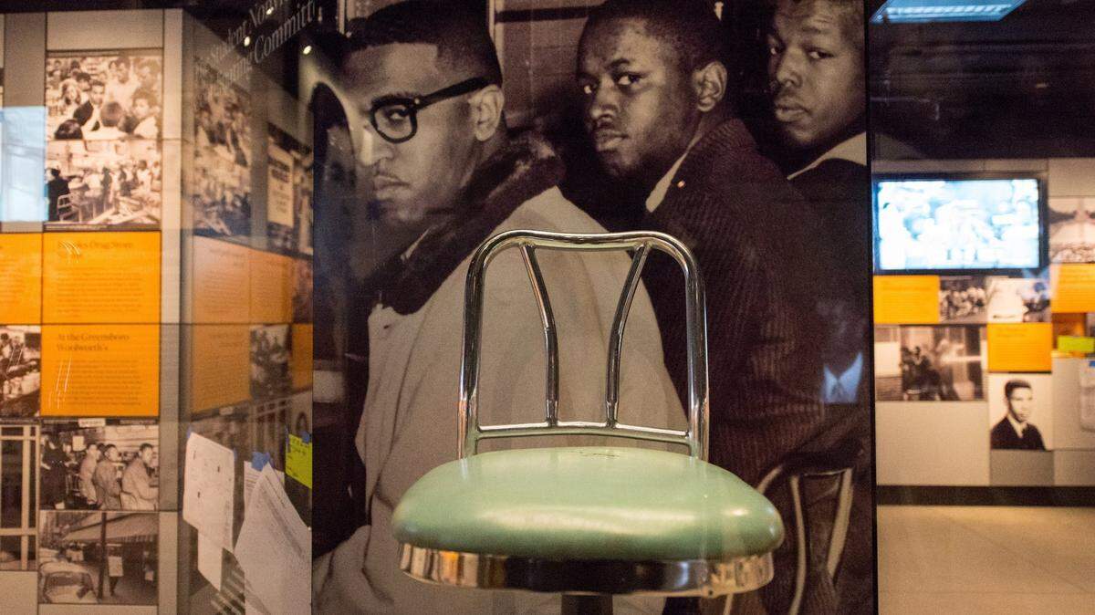 Woolworth Lunch Counter stools are exhibited at the Smithsonian’s National Museum of African American History and Culture in Washington, D.C., on Sept. 14, 2016.