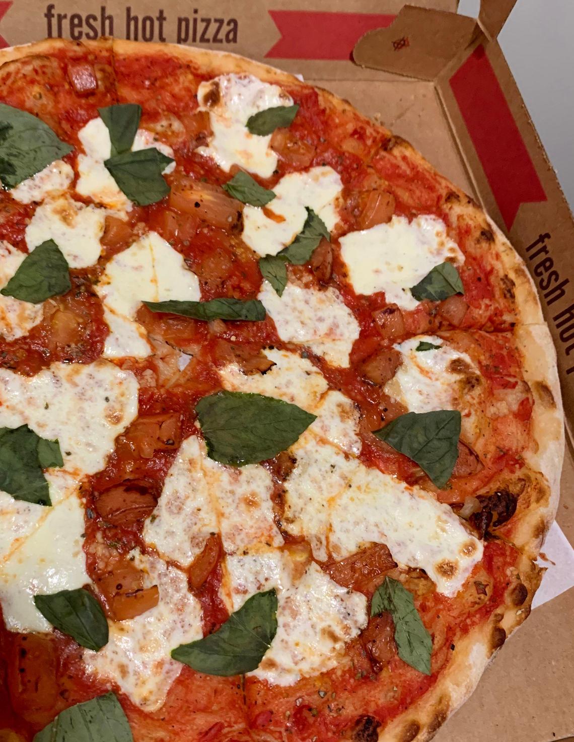 The margherita Veritas at Pizzeria Veritas in Cary is made up of fresh mozzarella, tomatoes, garlic and a generous scattering of torn basil leaves.