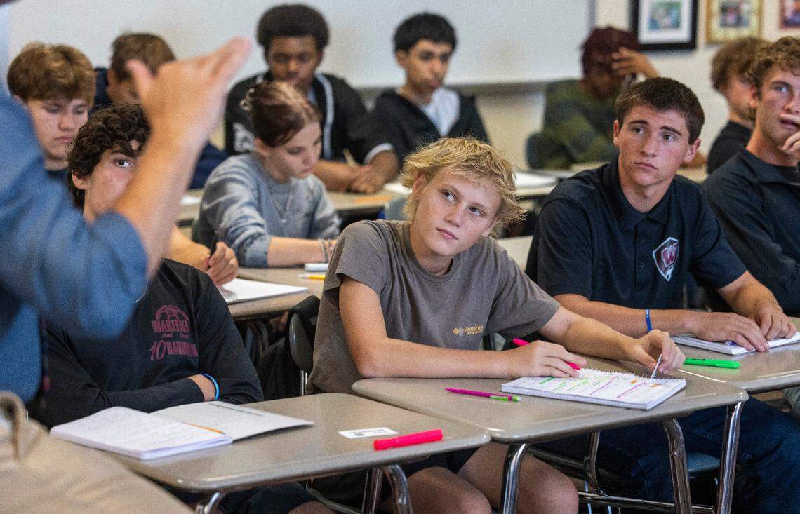 Wakefield High School student Luke Langheim, center, listens to teacher Anthony Calabria during his speech class on Tuesday, September 3, 2024 in Raleigh, N.C.