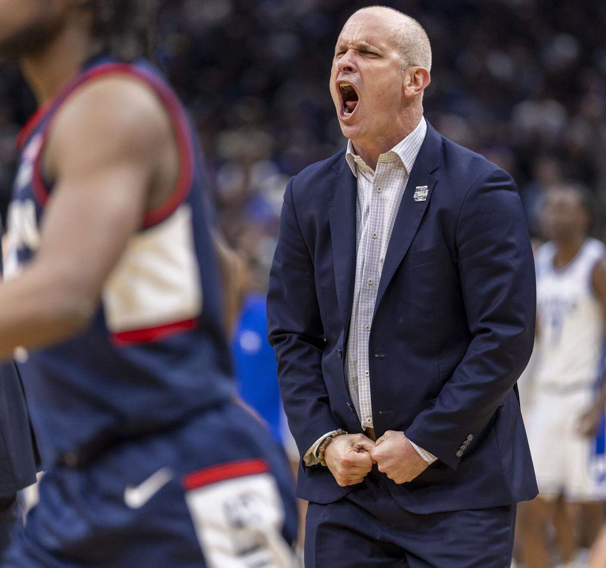 Connecticut coach Danny Hurley reacts after cutting the Duke lead to two points in the second half on Sunday, March 29, 2026, in the NCAA East Regional Championship, at Capital One Arena in Washington, D.C.