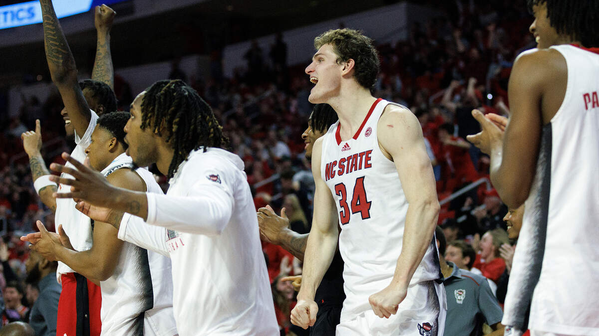 The N.C. State bench reacts after a made basket during the second half of the Wolfpack’s 74-68 win over Miami on Tuesday, Jan. 30, 2024, at PNC Arena in Raleigh, N.C.