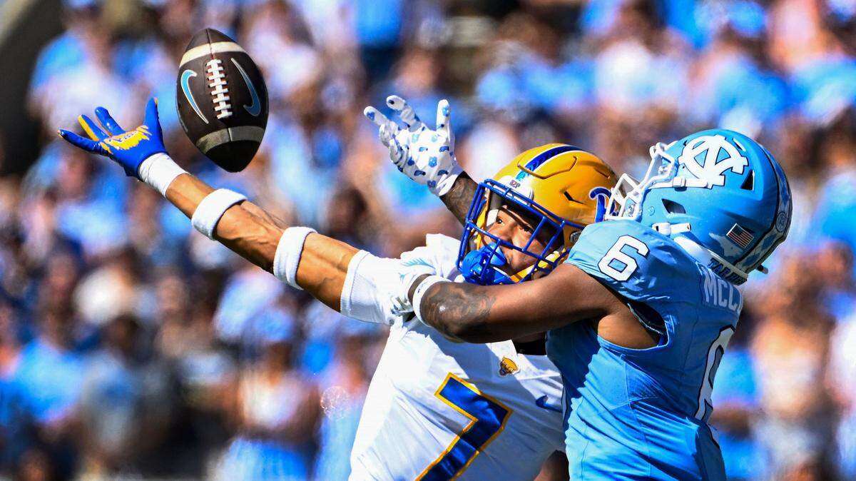 Pittsburgh Panthers defensive back Javon McIntyre (7) breaks up a pass intended for North Carolina Tar Heels wide receiver Nate McCollum (6) in the first quarter at Kenan Memorial Stadium.