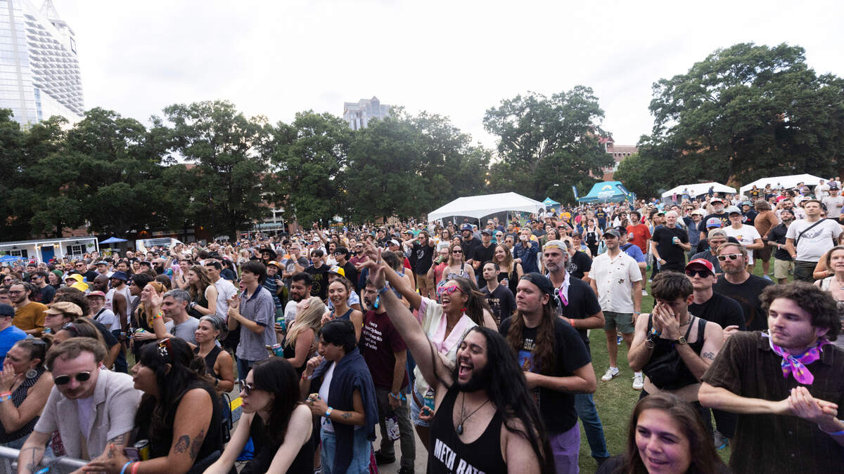 Concert-goers watch Chicano Batman perform at Moore Square in Raleigh during the Hopscotch Music Festival on Friday, Sept. 6, 2024.