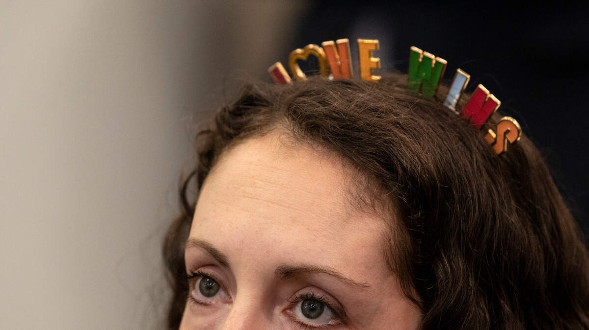 Nikki Doering wears a “Love Wins” headband while listening to a meeting of the Holly Springs Town Council on Tuesday, June 7, 2022 in Holly Springs, N.C. Requests for the town to issue a proclamation for Pride Month have been unsuccessful.